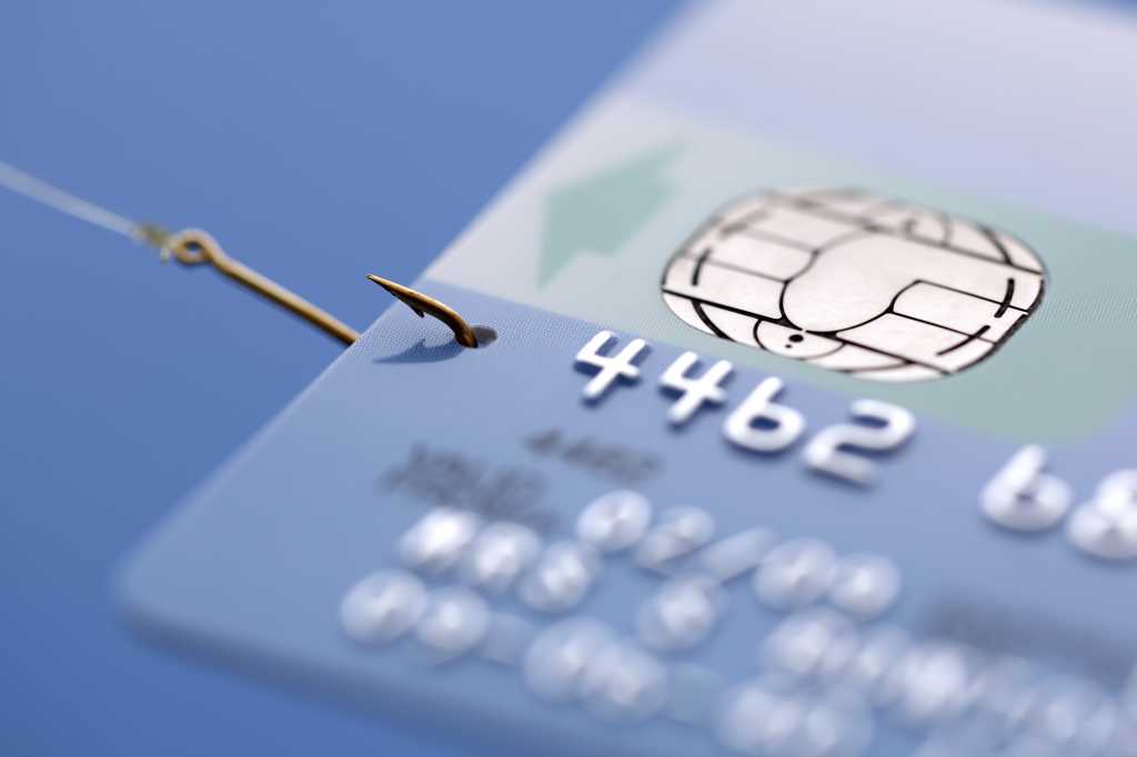 credit card caught on a fishing hook concept for addiction to spending with credit or phishing 9178