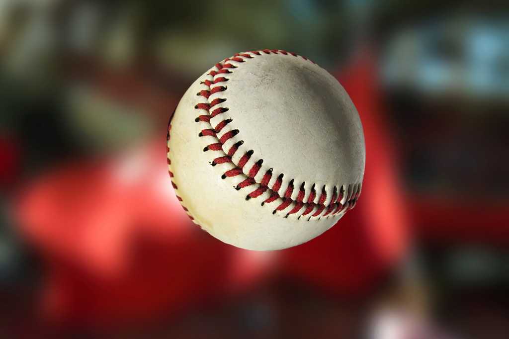 Baseball in front of a penant